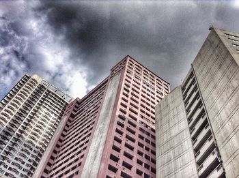 Low angle view of modern buildings against sky in city