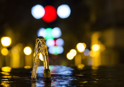 Close-up of illuminated lighting equipment in water