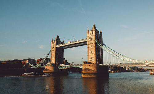 Tower bridge over thames river against sky