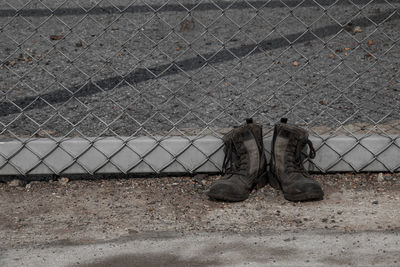 High angle view of shoes on footpath