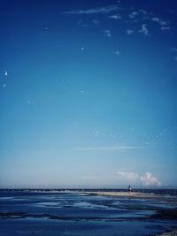 Scenic view of sea against blue sky