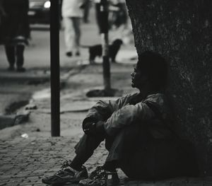 Close-up of man sitting outdoors