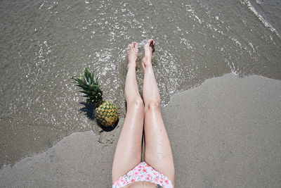 Low section of woman on beach