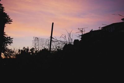 Low angle view of silhouette trees against sky during sunset