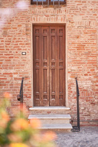 Rear view of man standing by wall