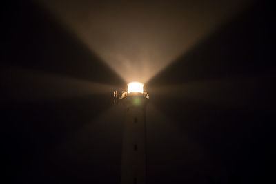 Low angle view of illuminated street light at night