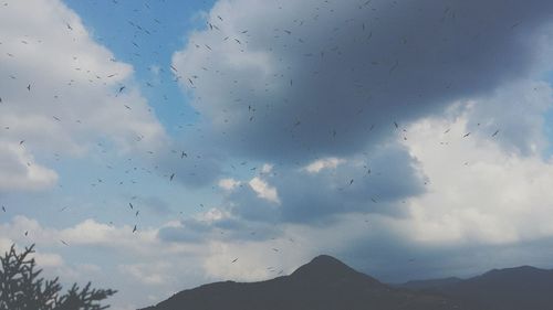 Low angle view of silhouette mountain against sky