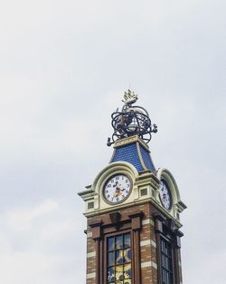 Low angle view of clock tower against sky