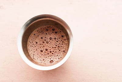 Directly above shot of coffee cup on white background