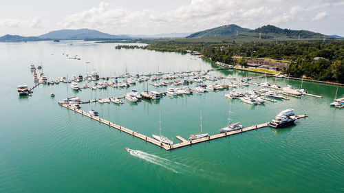 Yachts and boats in marina bay at phuket thailand aerial view