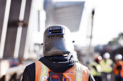 Rear view of construction worker at site