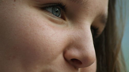 Close-up portrait of woman looking away