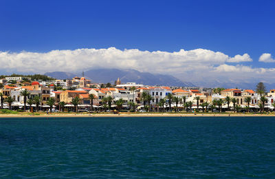 High angle view of town with mountain range in background