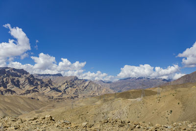 Scenic view of arid landscape against sky