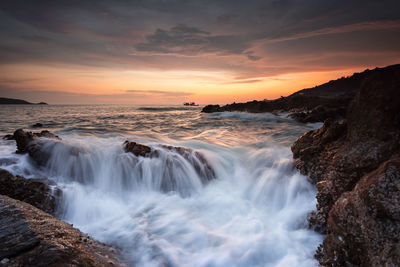 Scenic view of sea against sky during sunset