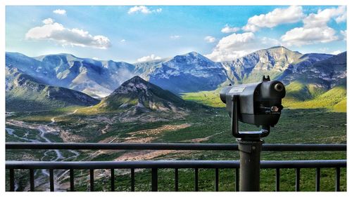 Scenic view of mountains from lookout point with a binocular