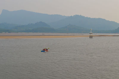 Scenic view of lake against mountain range