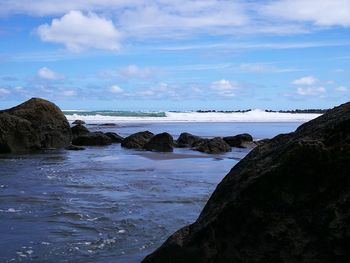 Scenic view of beach against sky