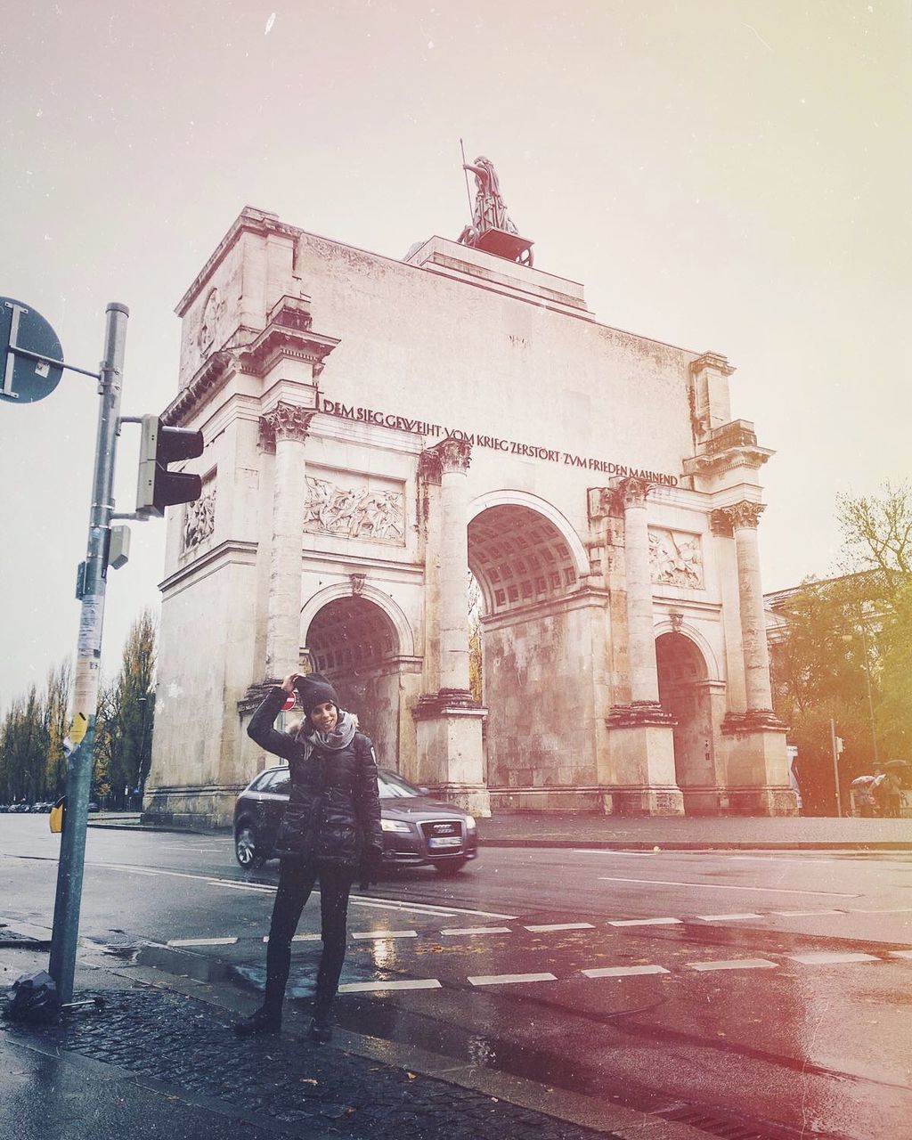 architecture, arch, built structure, real people, building exterior, tourism, outdoors, triumphal arch, city, travel destinations, full length, day, clear sky, one person, sky, young adult, adult, people