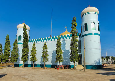 Low angle view of traditional building against clear blue sky