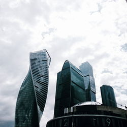 Low angle view of skyscrapers against sky