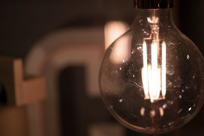 Close-up of illuminated light bulb