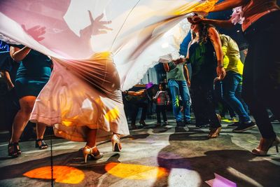 Group of people dancing at music concert