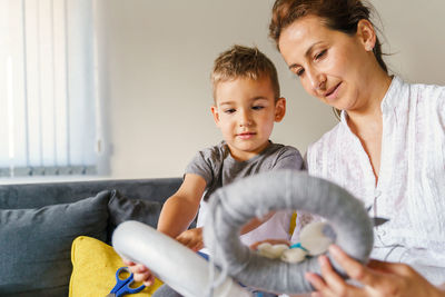 Mother and son playing at home