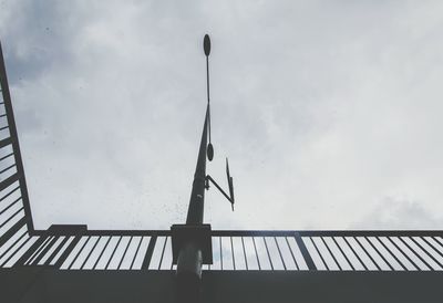 Low angle view of silhouette bridge against sky