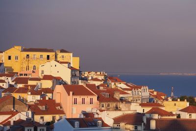 Houses in town against sky