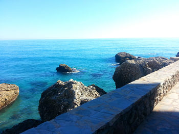 Scenic view of sea against blue sky