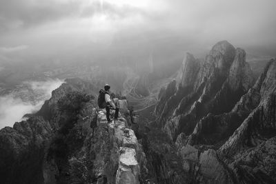 One man standing on a narrow edge at a high area in la huasteca