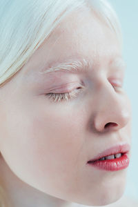 Close-up portrait of woman with eyes closed