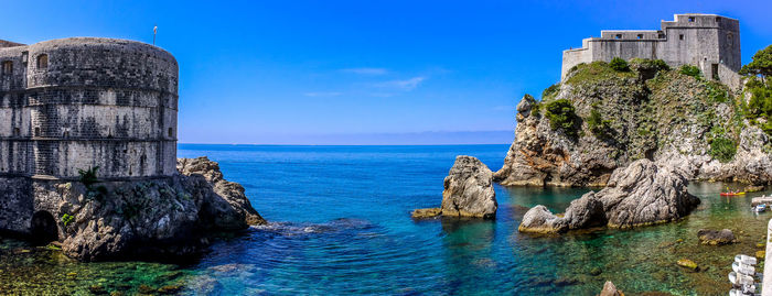 Panoramic view of sea against blue sky