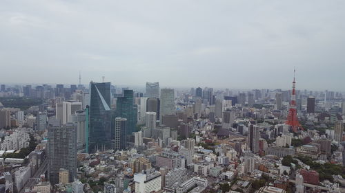 High angle view of modern buildings in city against sky