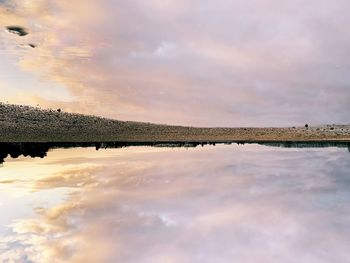 Scenic view of lake against sky during sunset