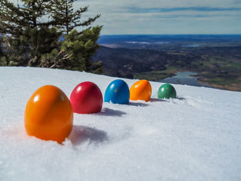 Close-up of multi colored ball on shore