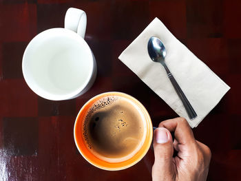 High angle view of coffee cup on table