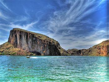 Scenic view of sea and rocks against sky