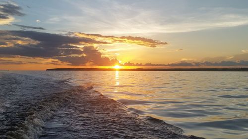 Scenic view of sea against sky during sunset