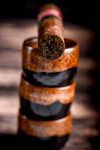 Close-up of cigar on table