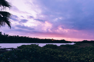 Scenic view of lake against sky during sunset