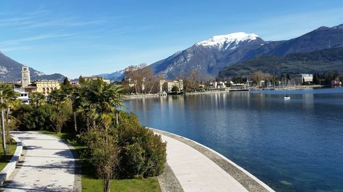 Scenic view of river and mountains against sky