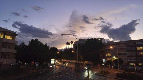 City street against cloudy sky