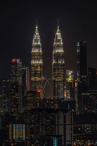 Illuminated buildings in city at night