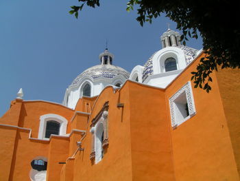 Low angle view of bell tower against sky