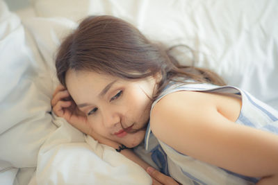 Young woman in bed