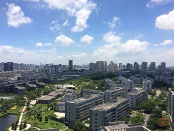 High angle view of buildings in city against sky