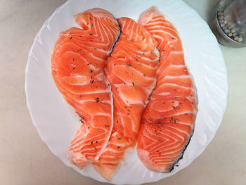 High angle view of fish in plate on table