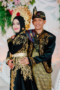 Portrait of smiling bridegroom during wedding ceremony